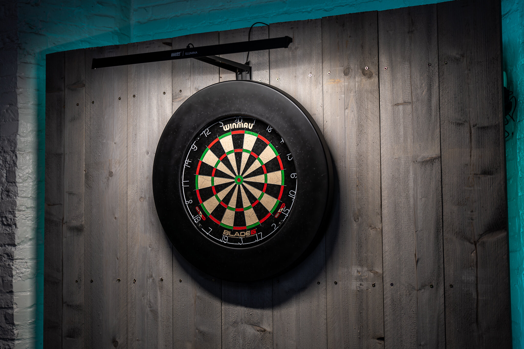 Three pink cocktails on a bar
